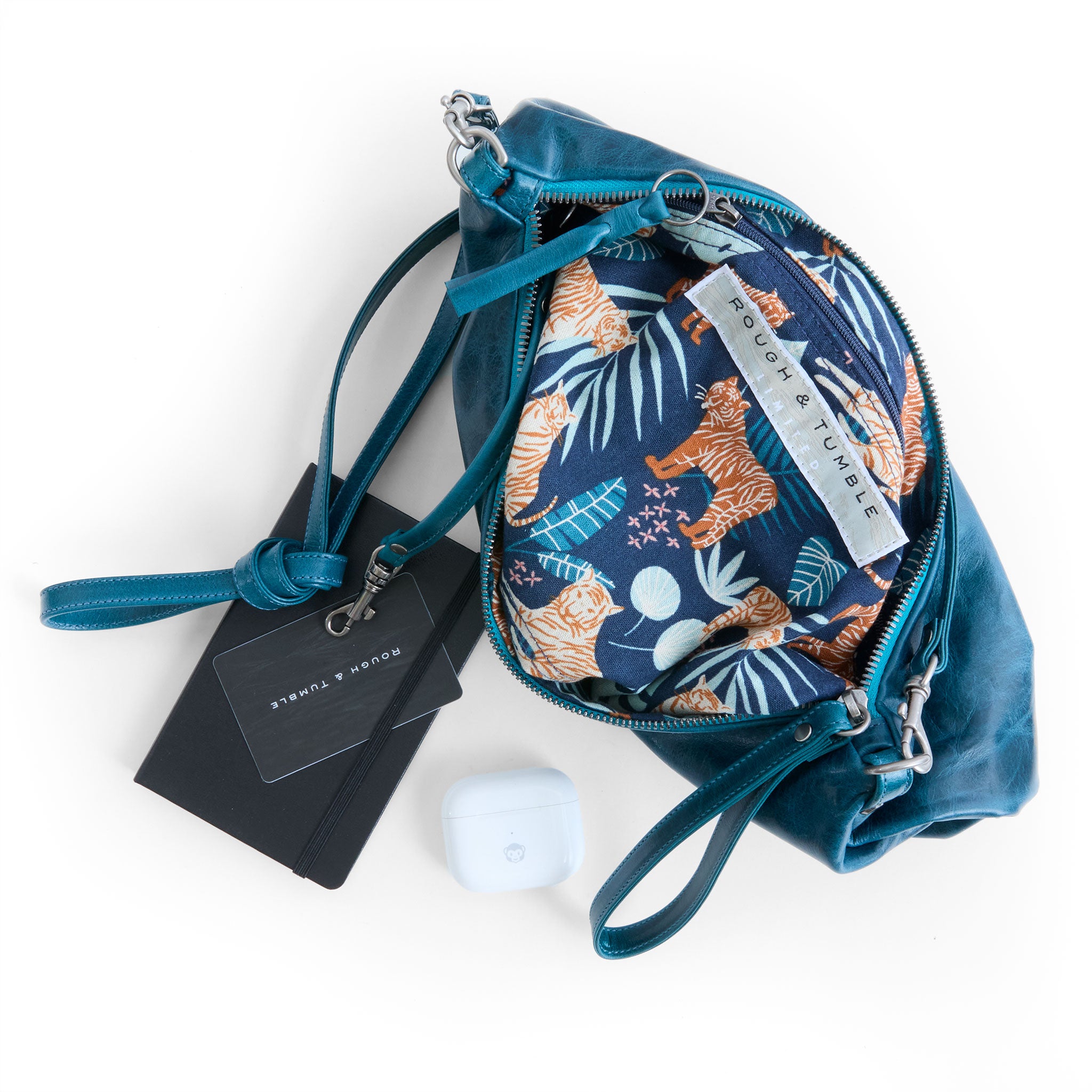 the covet in tourmaline, showcasing interior jungle cruisin' lining and zippered pocket