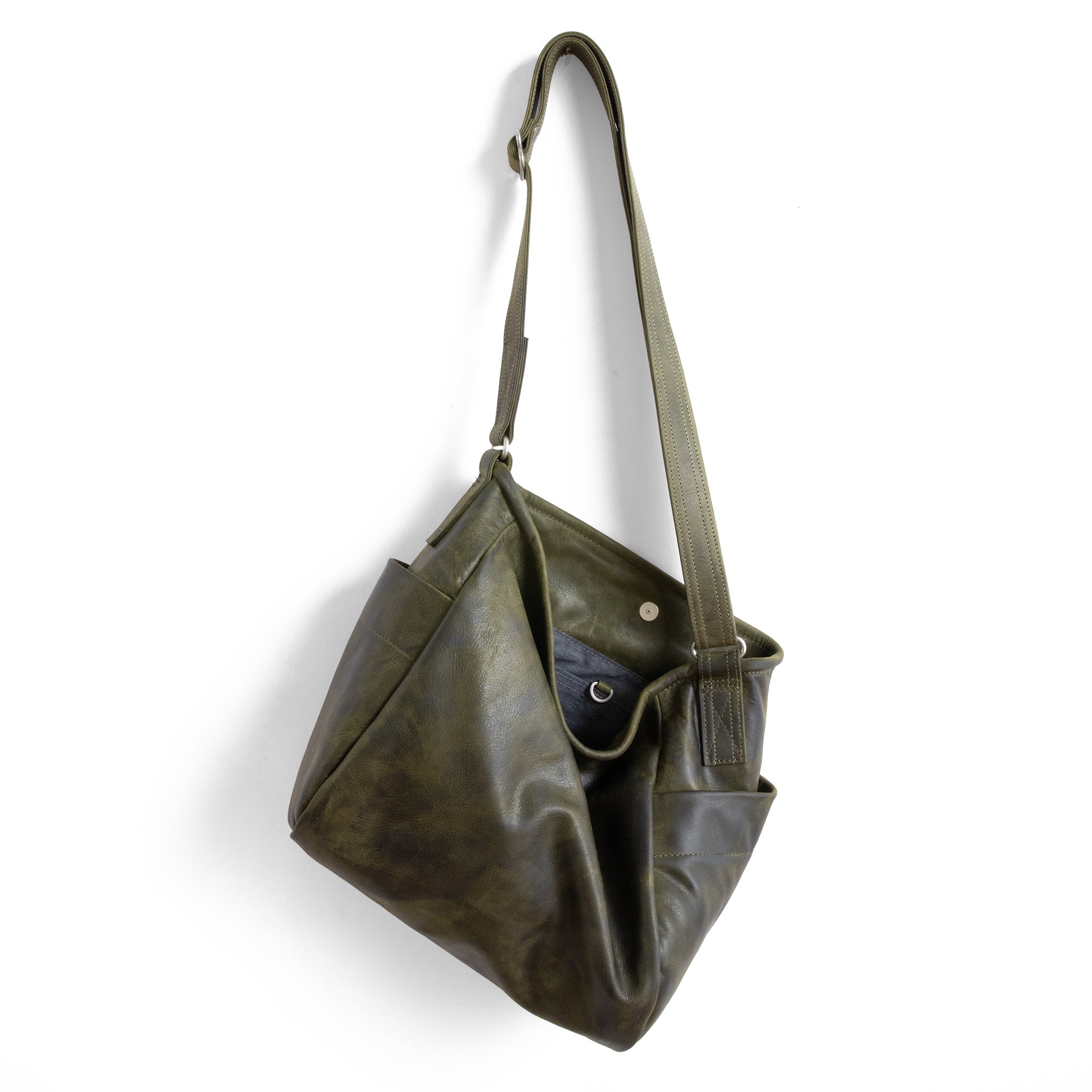 bucket in moss, showcasing interior grey chambray lining